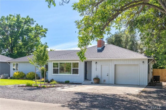 1105 Glenwood Ave, Chico, CA 95926 - single story home featuring a chimney, concrete driveway, a garage, fence, and roof with shingles