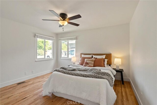 1105 Glenwood Ave, Chico, CA 95926 - bedroom with baseboards, wood finished floors, and a ceiling fan