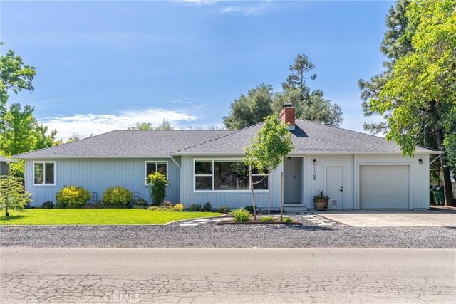 1105 Glenwood Ave, Chico, CA 95926 - single story home with a chimney, a garage, driveway, and a front lawn