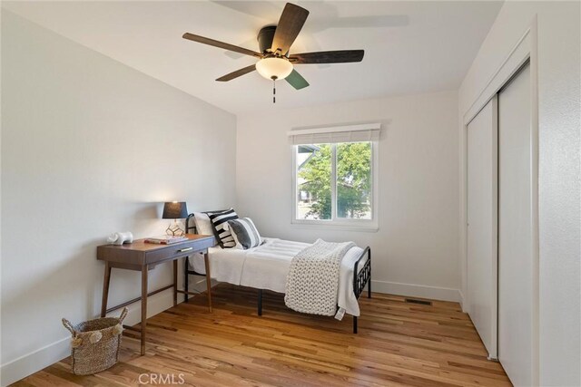 1105 Glenwood Ave, Chico, CA 95926 - bedroom with light wood finished floors, a closet, baseboards, and ceiling fan