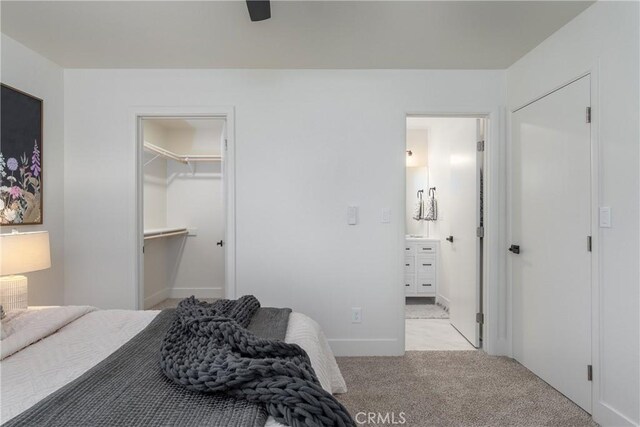 1105 Glenwood Ave, Chico, CA 95926 - bedroom with light carpet, a walk in closet, ensuite bath, and a closet