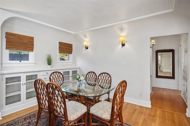 31462 La Matanza St, San Juan Capistrano, CA 92675 - dining space with light wood-type flooring, baseboards, and crown molding