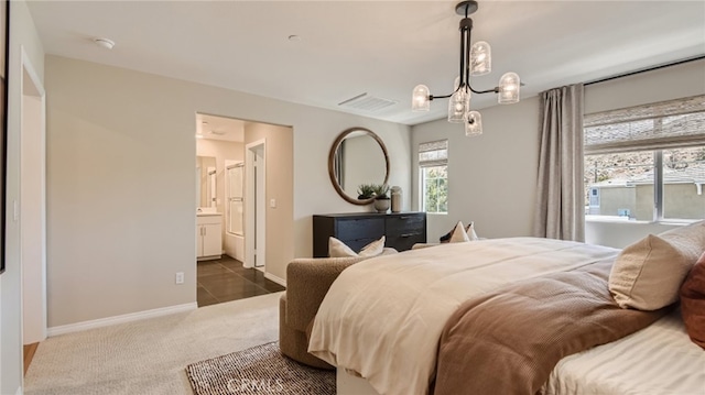 30025 Adrift Ln, Menifee, CA 92584 - carpeted bedroom with a chandelier, baseboards, and connected bathroom
