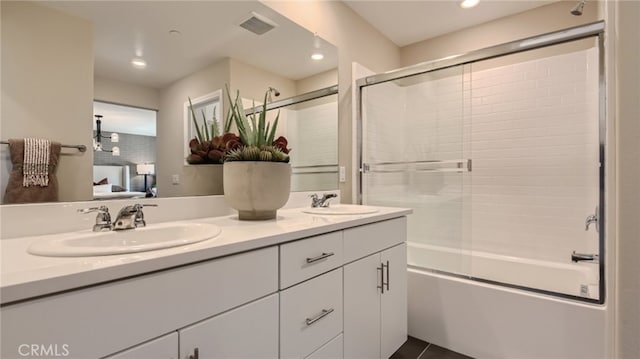 30025 Adrift Ln, Menifee, CA 92584 - full bath featuring ensuite bath, double vanity, shower / bath combination with glass door, and recessed lighting