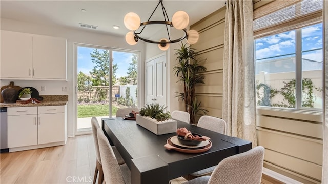 30025 Adrift Ln, Menifee, CA 92584 - dining space with plenty of natural light, a chandelier, and light wood finished floors