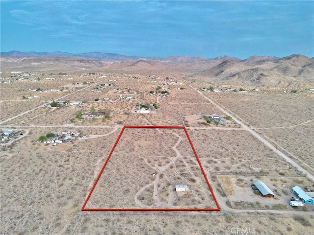 177 Cherokee Trl, Yucca Valley, CA 92284 - view of rural area with a mountain backdrop, a desert landscape, and property boundaries highlighted