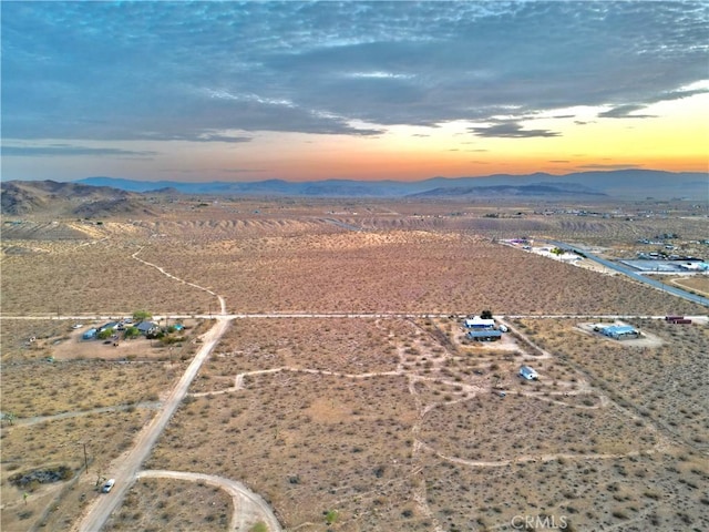 177 Cherokee Trl, Yucca Valley, CA 92284 - aerial view at dusk of a mountain view, view of desert landscape, and a rural view