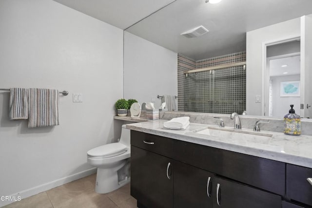 3903 Ocean Dr, Oxnard, CA 93035 - full bathroom featuring a shower stall, tile patterned flooring, toilet, baseboards, and vanity