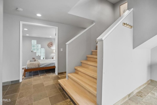 3903 Ocean Dr, Oxnard, CA 93035 - stairway with baseboards and recessed lighting