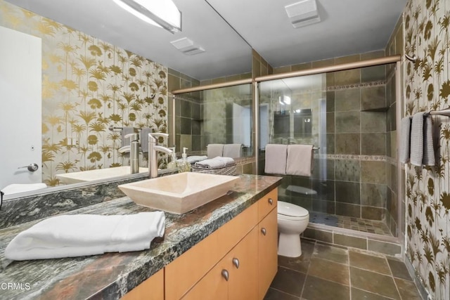 3903 Ocean Dr, Oxnard, CA 93035 - bathroom featuring wallpapered walls, vanity, toilet, and a shower stall