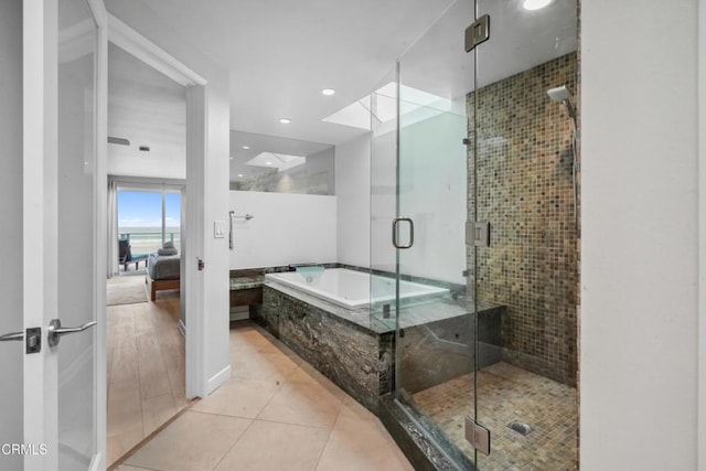 3903 Ocean Dr, Oxnard, CA 93035 - bathroom with a shower stall, a garden tub, tile patterned flooring, connected bathroom, and recessed lighting