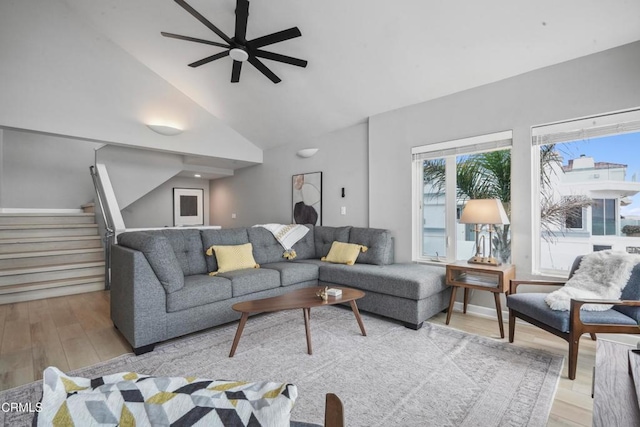 3903 Ocean Dr, Oxnard, CA 93035 - living area featuring light wood-style floors, ceiling fan, stairs, and high vaulted ceiling