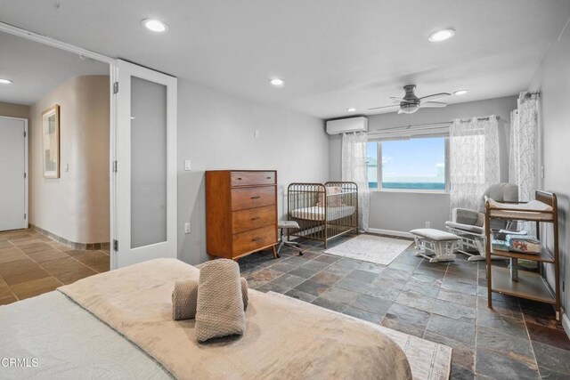 3903 Ocean Dr, Oxnard, CA 93035 - bedroom featuring stone tile floors, a wall mounted AC, recessed lighting, and a ceiling fan