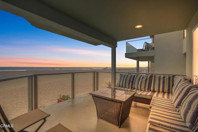 3903 Ocean Dr, Oxnard, CA 93035 - balcony at dusk with a water view and outdoor lounge area
