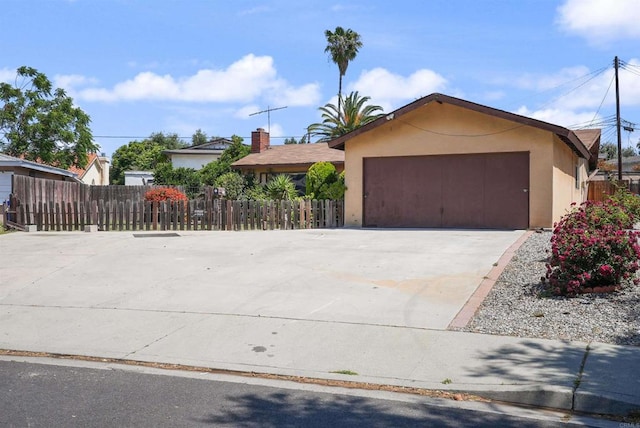 1520 Flanagan St, Pomona, CA 91766 - ranch-style home with stucco siding, fence, concrete driveway, and a garage