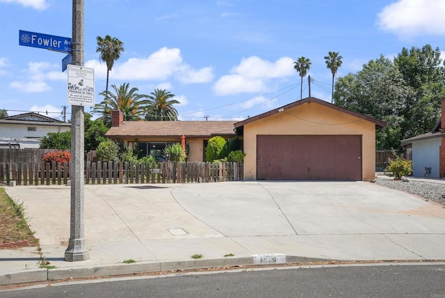 1520 Flanagan St, Pomona, CA 91766 - single story home featuring driveway, a garage, stucco siding, and fence