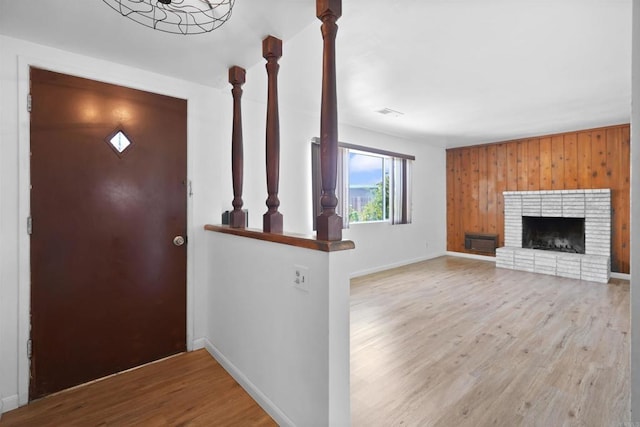 1520 Flanagan St, Pomona, CA 91766 - foyer featuring wood finished floors, baseboards, and a brick fireplace