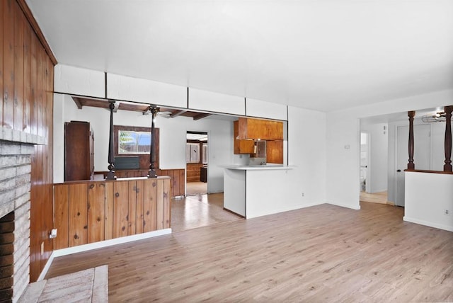 1520 Flanagan St, Pomona, CA 91766 - unfurnished living room with light wood-type flooring, a ceiling fan, a fireplace, and baseboards