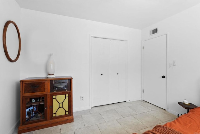 1520 Flanagan St, Pomona, CA 91766 - bedroom featuring baseboards, a closet, and light tile patterned floors