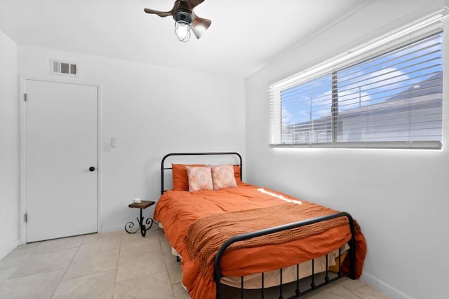 1520 Flanagan St, Pomona, CA 91766 - bedroom featuring baseboards, light tile patterned floors, and a ceiling fan