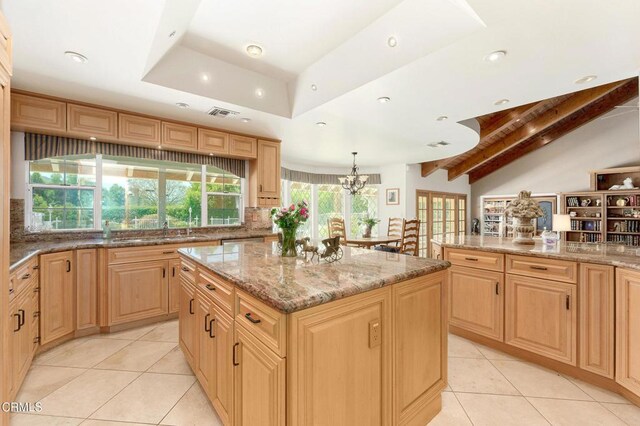 11616 E Las Posas Rd, Camarillo, CA 93012 - kitchen featuring light tile patterned floors, light brown cabinetry, light stone counters, a kitchen island, and recessed lighting