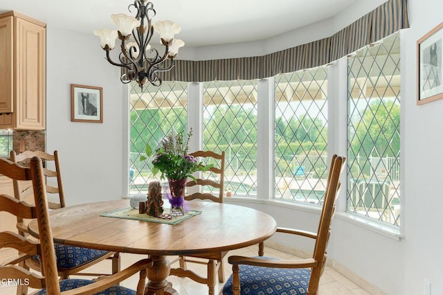 11616 E Las Posas Rd, Camarillo, CA 93012 - tiled dining area featuring a chandelier and baseboards