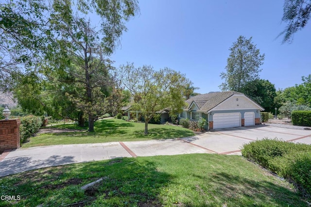 11616 E Las Posas Rd, Camarillo, CA 93012 - view of green lawn featuring a garage and concrete driveway