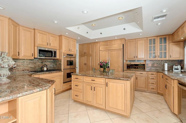 11616 E Las Posas Rd, Camarillo, CA 93012 - kitchen with light brown cabinetry, appliances with stainless steel finishes, a raised ceiling, light tile patterned floors, and recessed lighting