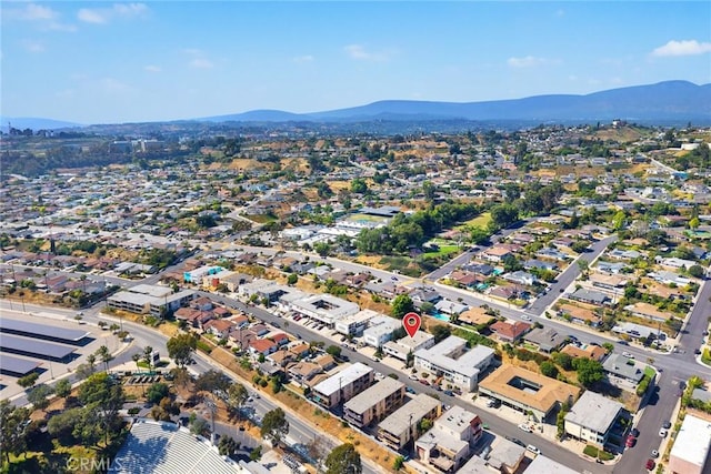 aerial overview of property's location featuring a mountain backdrop