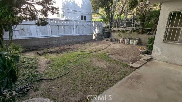 view of yard featuring fence