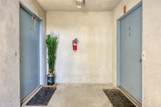 property entrance featuring stucco siding