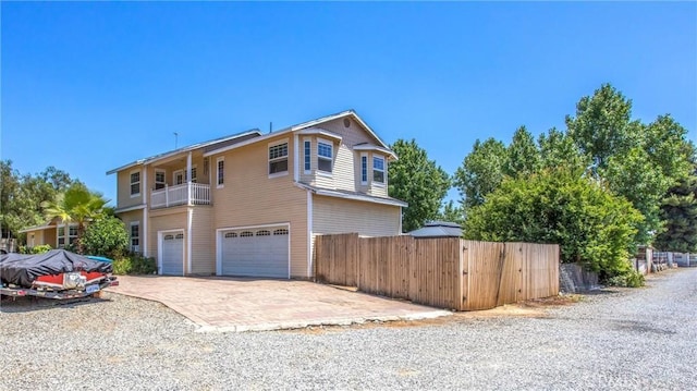 375 E County Line Rd, Calimesa, CA 92320 - view of front facade featuring a garage, a balcony, and driveway