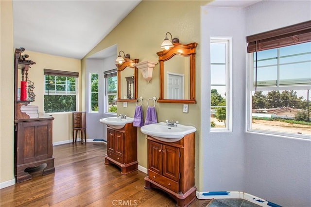 375 E County Line Rd, Calimesa, CA 92320 - full bathroom featuring two vanities, wood finished floors, and lofted ceiling