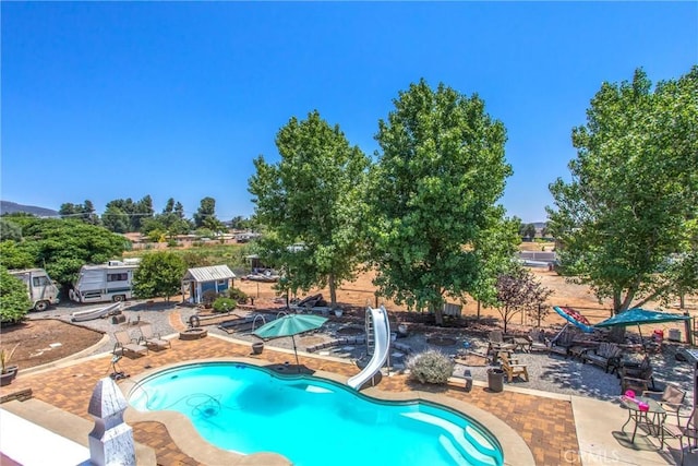 375 E County Line Rd, Calimesa, CA 92320 - outdoor pool featuring a water slide and a patio