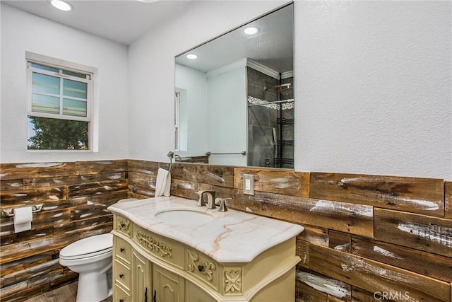 375 E County Line Rd, Calimesa, CA 92320 - full bathroom featuring vanity, recessed lighting, wood finished floors, and a tile shower