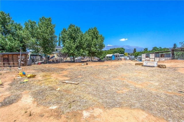 375 E County Line Rd, Calimesa, CA 92320 - view of yard with a mountain view and an exterior structure