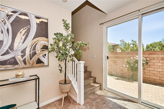 2910 E Via Terrano, Ontario, CA 91764 - doorway to outside featuring plenty of natural light, baseboards, and stairs