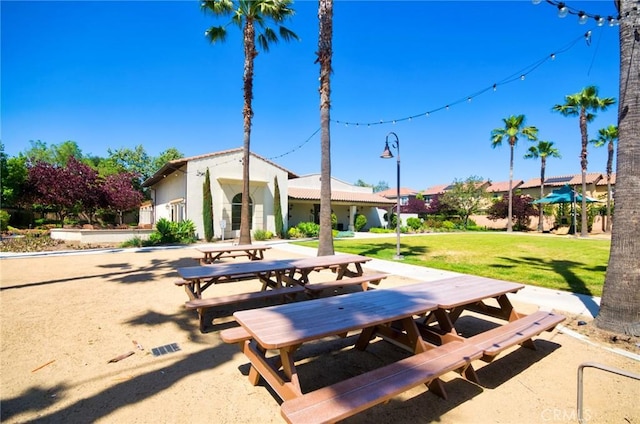 2910 E Via Terrano, Ontario, CA 91764 - view of home's community featuring outdoor dining space, a lawn, and a patio