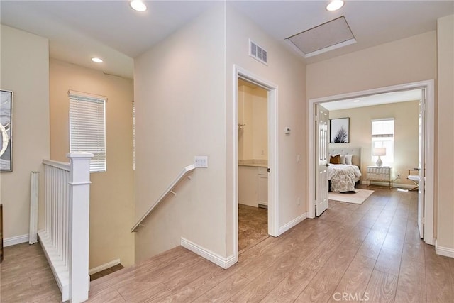 2910 E Via Terrano, Ontario, CA 91764 - corridor with an upstairs landing, light wood-type flooring, attic access, recessed lighting, and baseboards