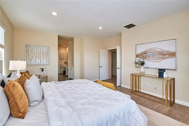 2910 E Via Terrano, Ontario, CA 91764 - bedroom with wood finished floors, baseboards, recessed lighting, and ensuite bath