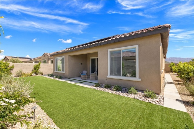 27 Medoc, Rancho Mirage, CA 92270 - back of house with stucco siding, a patio area, and a tile roof