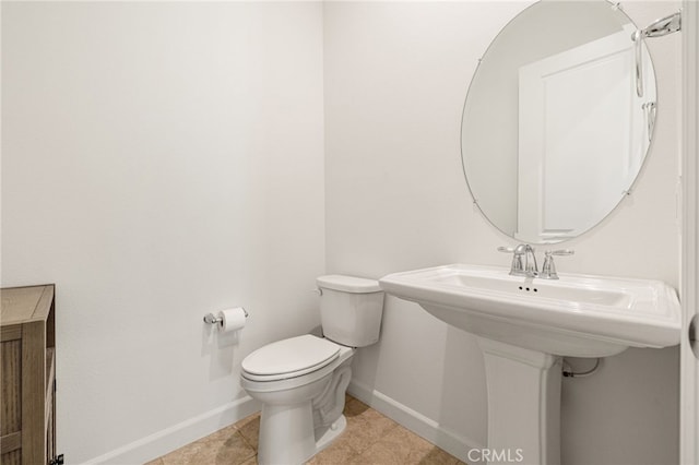 27 Medoc, Rancho Mirage, CA 92270 - half bathroom with baseboards, toilet, and tile patterned flooring