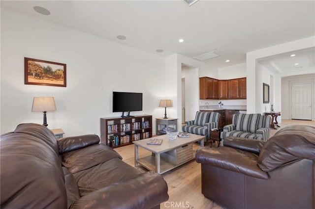 27 Medoc, Rancho Mirage, CA 92270 - living room with light wood-type flooring and recessed lighting