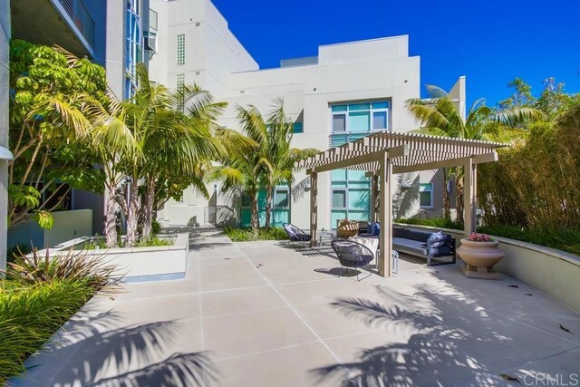 view of patio / terrace with a pergola and an outdoor living space