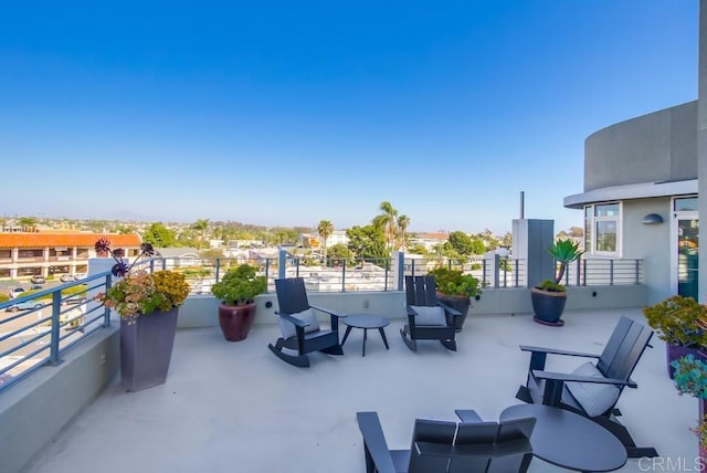 view of patio / terrace with a balcony