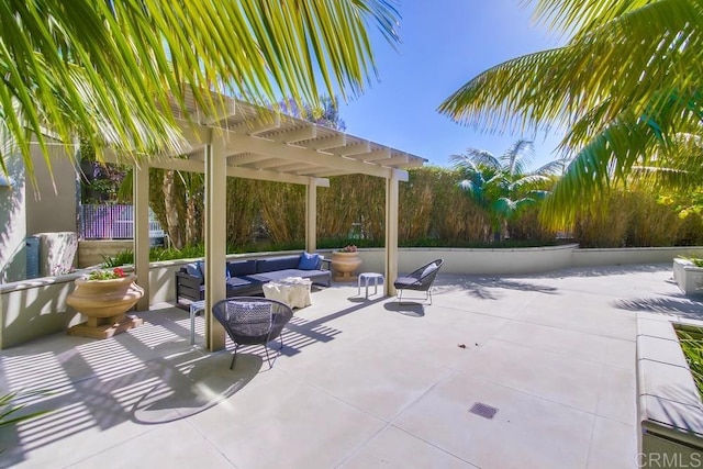 view of patio with an outdoor living space and a pergola