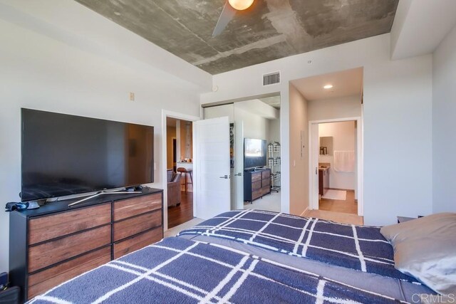 bedroom with a closet and connected bathroom