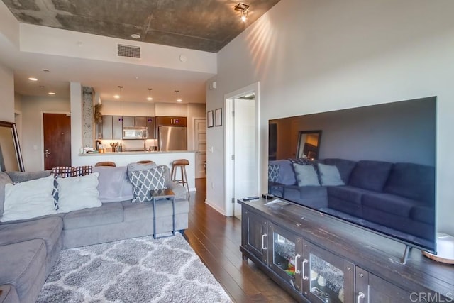living area with dark wood-type flooring