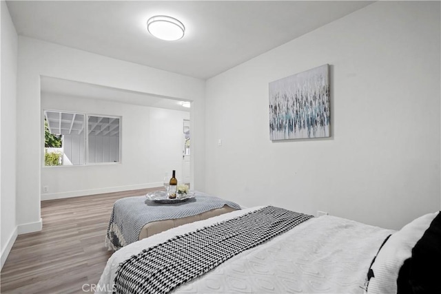 5616 Buffalo Ave, Valley Glen, CA 91401 - bedroom featuring wood finished floors and baseboards