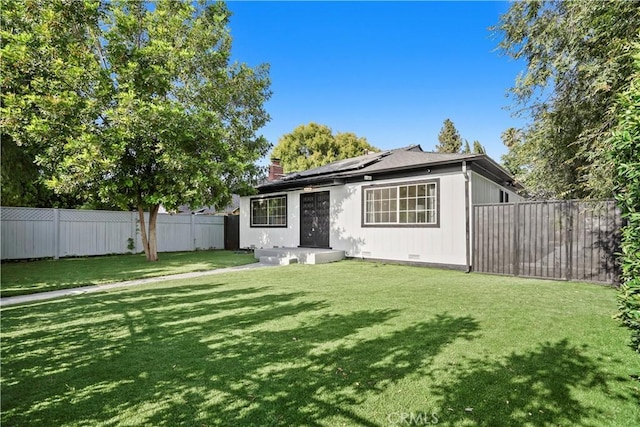 5616 Buffalo Ave, Valley Glen, CA 91401 - view of front of property with solar panels, a chimney, and a fenced backyard